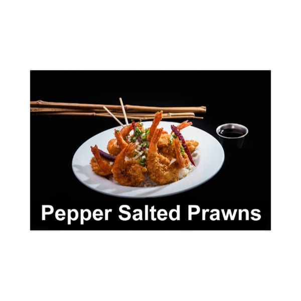 Pepper Salted Prawns on a white plate with rice, garnished with onions and red peppers.