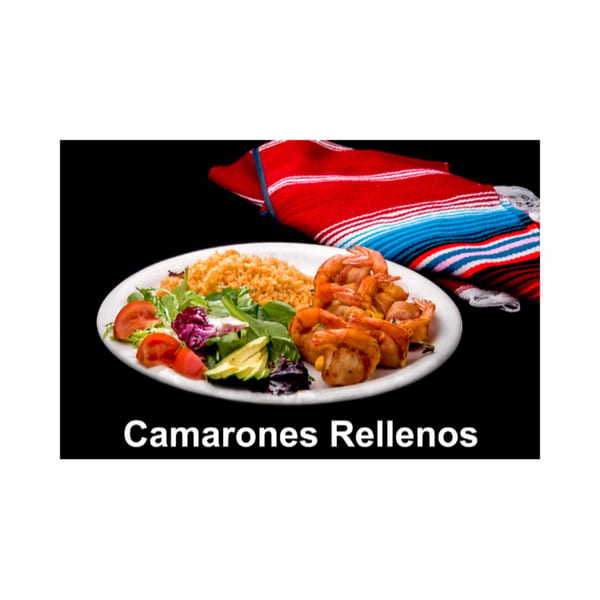 Camarones Rellenos with rice and salad on a white plate, with a colorful striped serape.