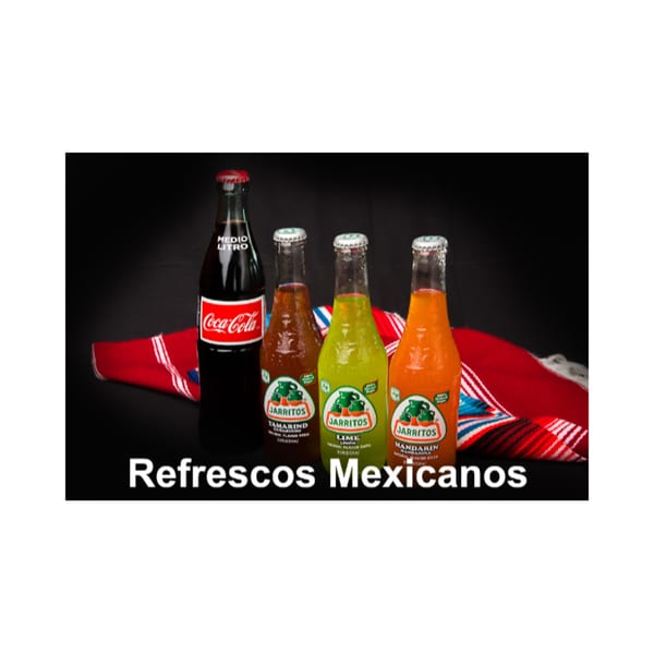 A Coca-Cola and three Jarritos sodas (Tamarind, Lime, Mandarin) on a red and white striped cloth.
