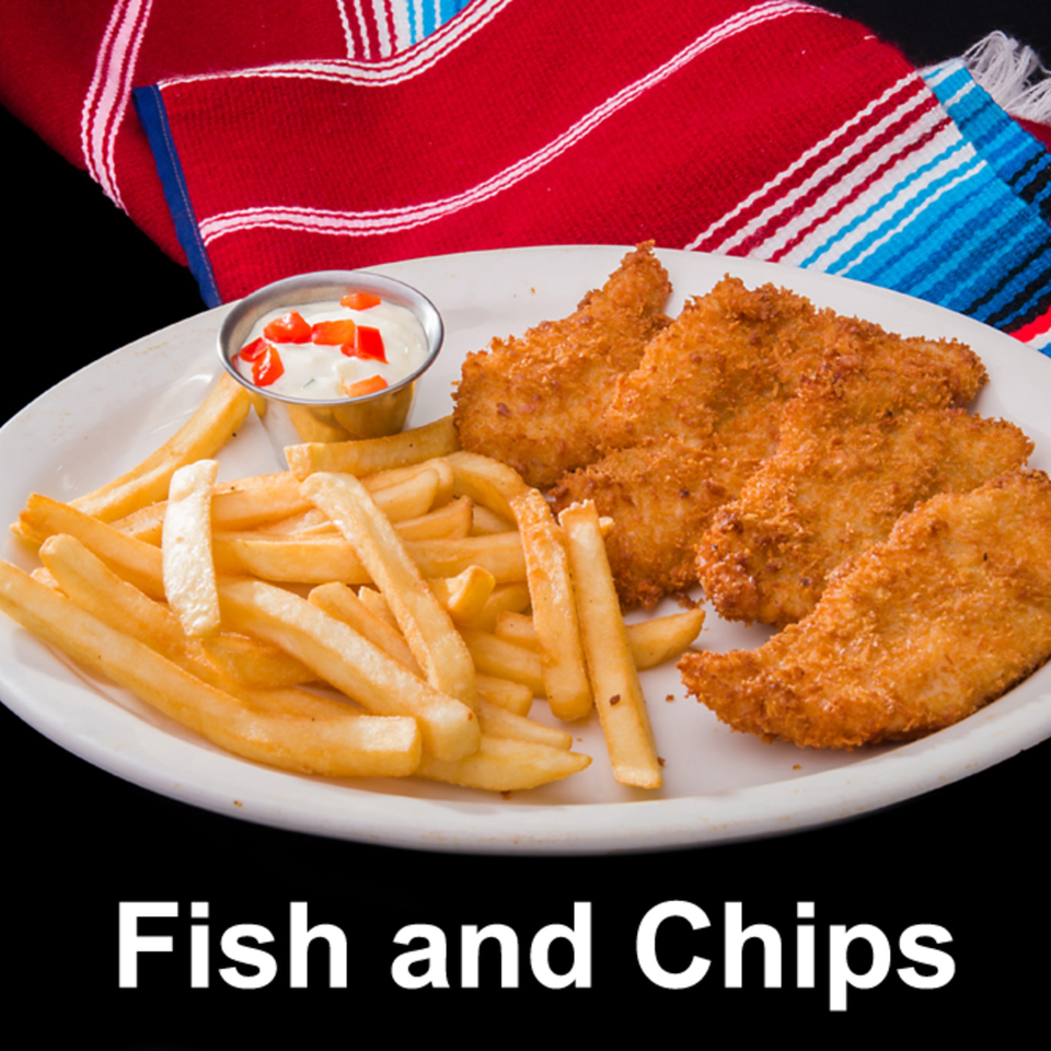 Crispy fried fish fillets and golden french fries with a side of white dipping sauce.